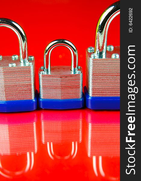 Padlocks isolated against a red background