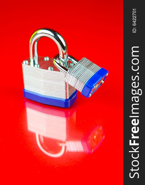 Padlocks isolated against a red background