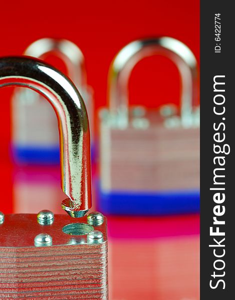 Padlocks isolated against a red background