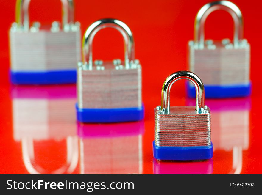 Padlocks isolated against a red background