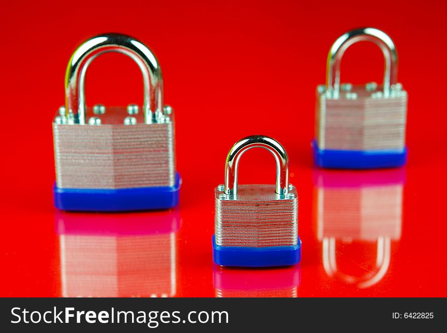 Padlocks isolated against a red background