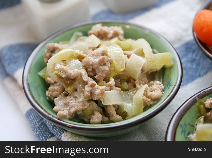 A meal of fresh chicory and some meat. A meal of fresh chicory and some meat