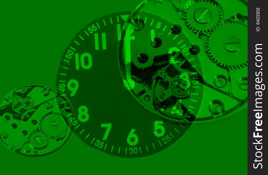 Photo of watch and his internal mechanism on green background. Photo of watch and his internal mechanism on green background