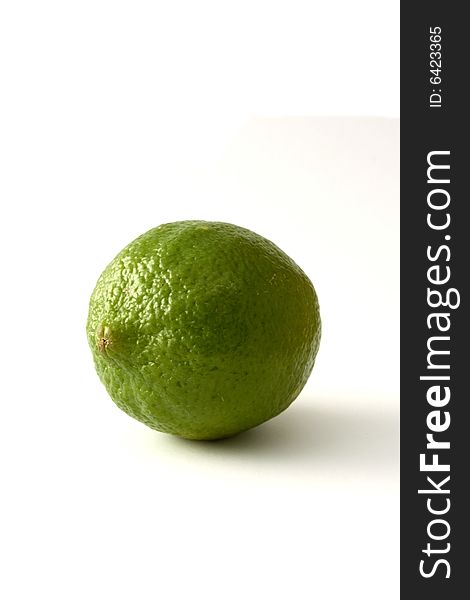A green lime fruit isloated on a white background