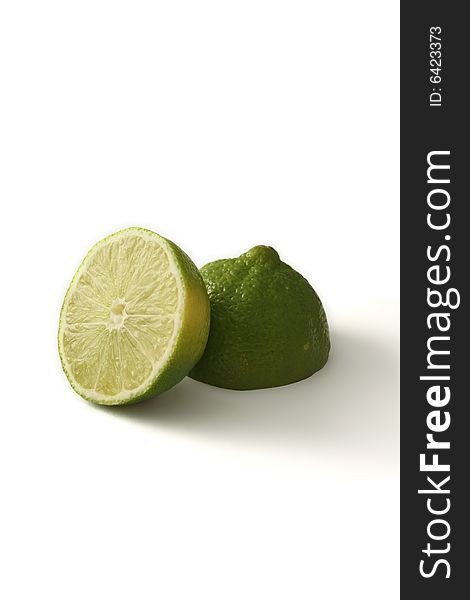 A green lime fruit sliced, isloated on a white background