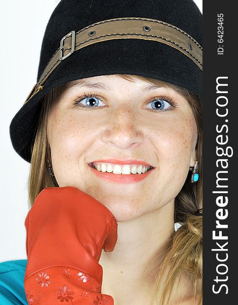 Pretty blue-eyed girl in hat and red gloves. Pretty blue-eyed girl in hat and red gloves