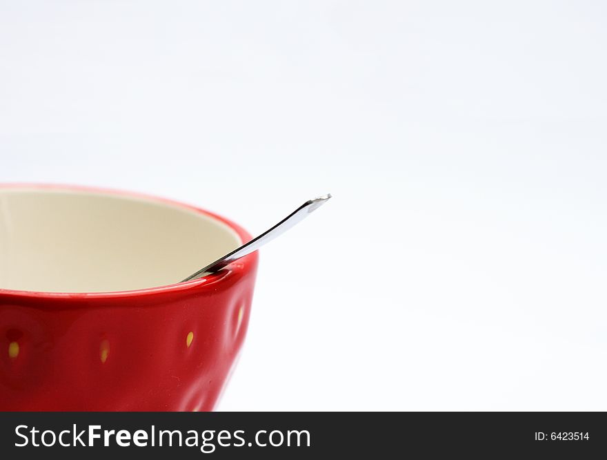 Red cup with spoon - isolated