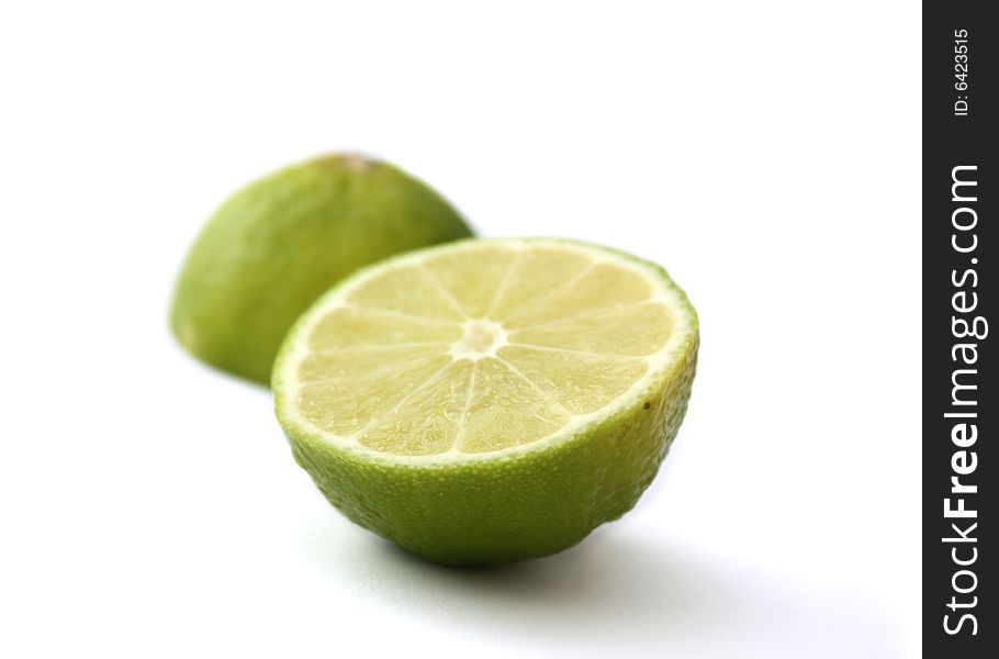 A green lime fruit sliced, isloated on a white background
