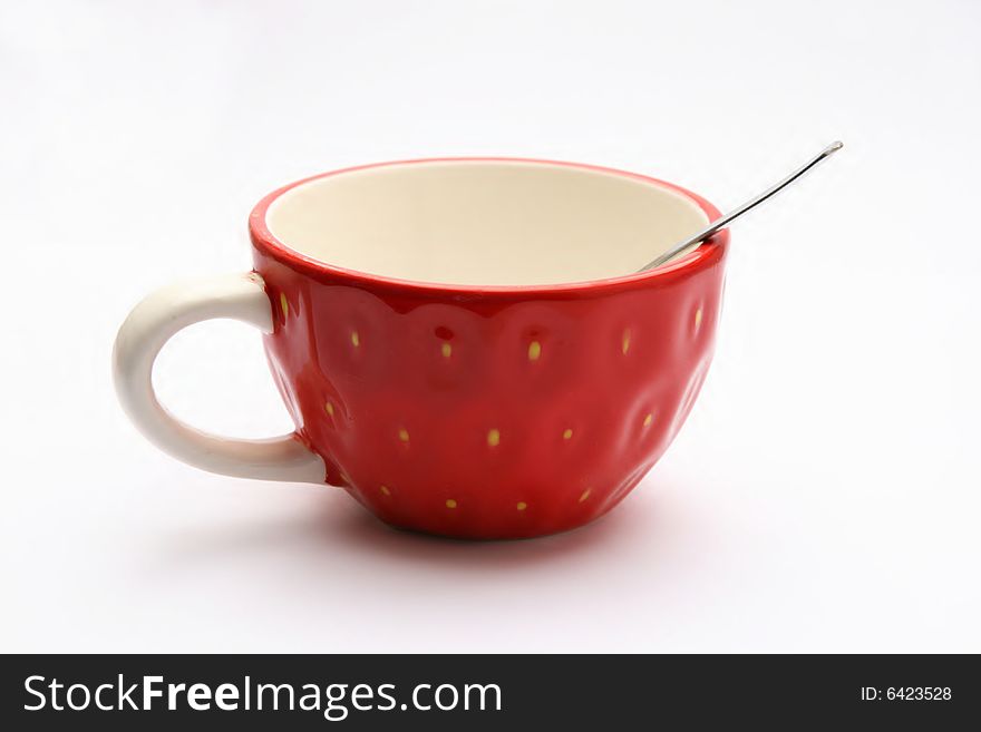 Red cup with spoon - isolated
