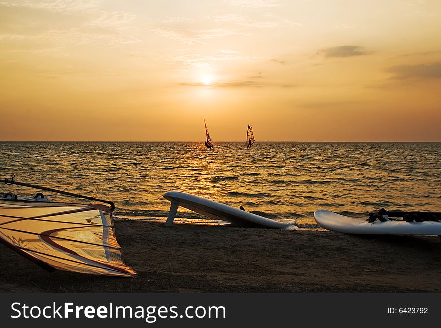 Silhouette Of A Two Windsurfer