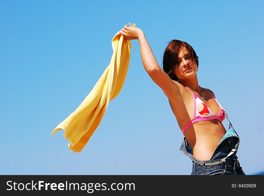 Young girl on the beach enjoying summertime