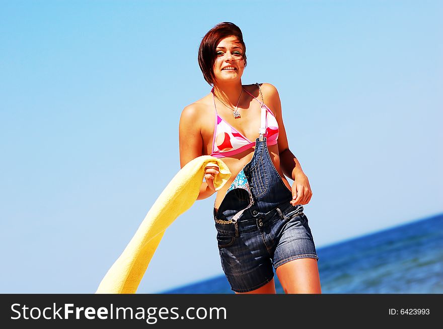 Young attractive woman enjoying summertime on the beach. Young attractive woman enjoying summertime on the beach