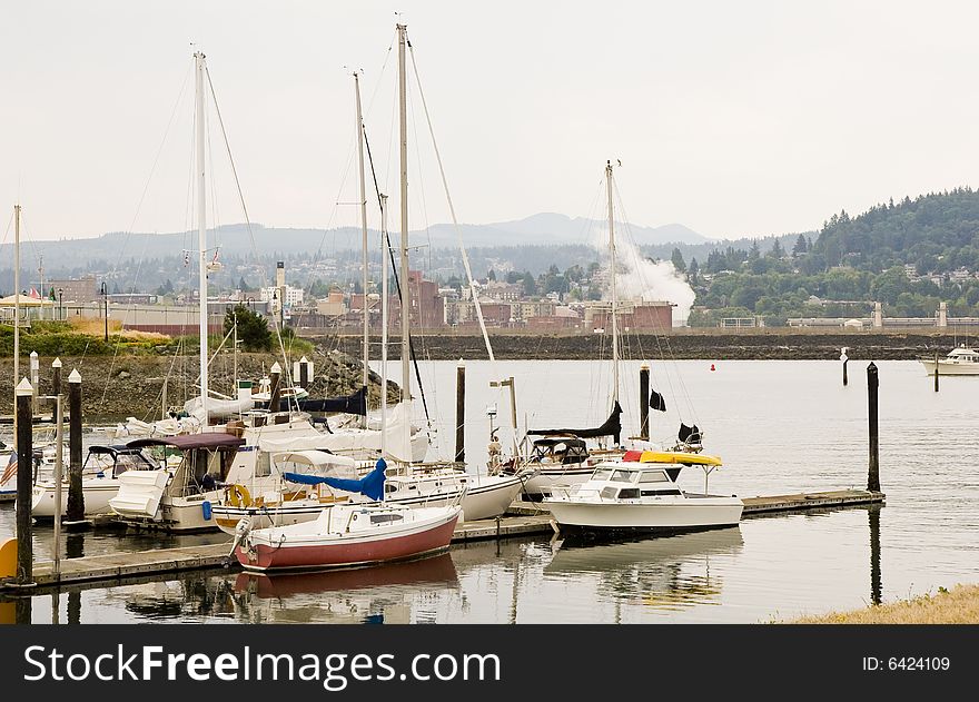 An old fishing dock in front of a city. An old fishing dock in front of a city