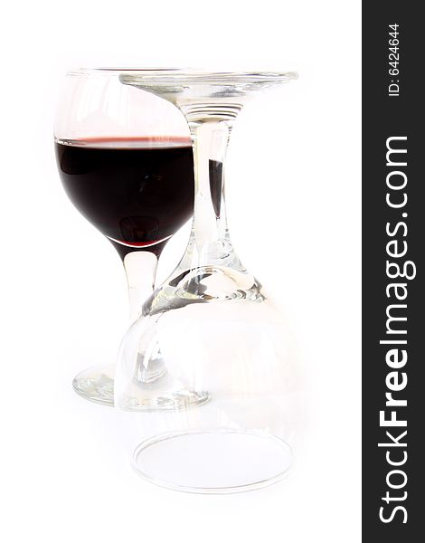 Glass with red wine at white