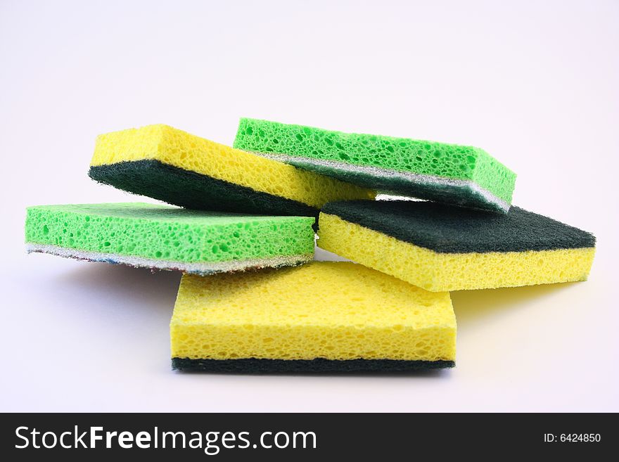 Household cleaning sponges on a white background.