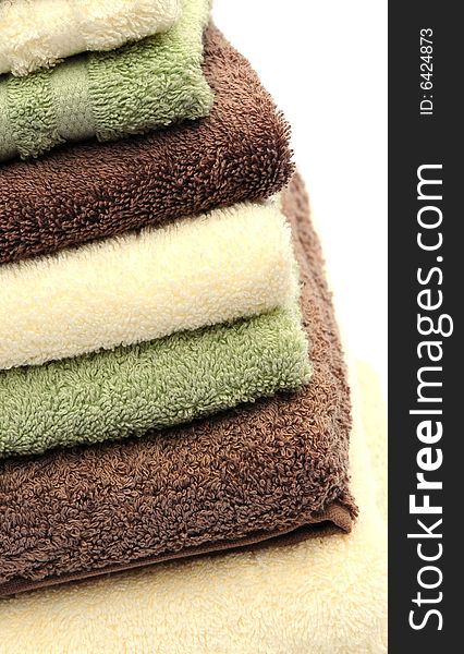 Shot of three different coloured towels in a stack