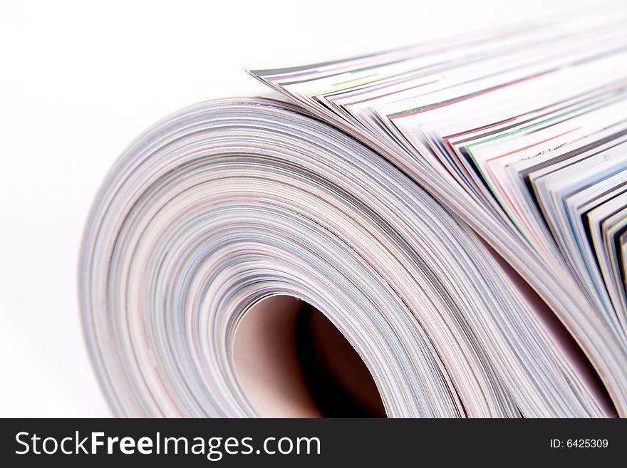 Three color magazines rolled on white background. Three color magazines rolled on white background