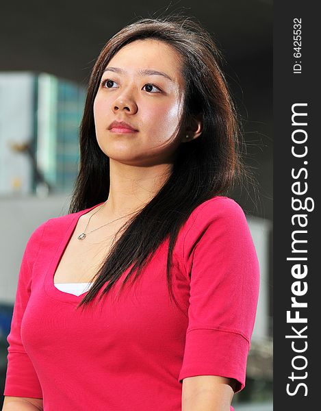 Picture of an Asian Girl with office landscape behind. Suitable for contexts of office environment, casual staff, part-timers, and even interns. Picture of an Asian Girl with office landscape behind. Suitable for contexts of office environment, casual staff, part-timers, and even interns.