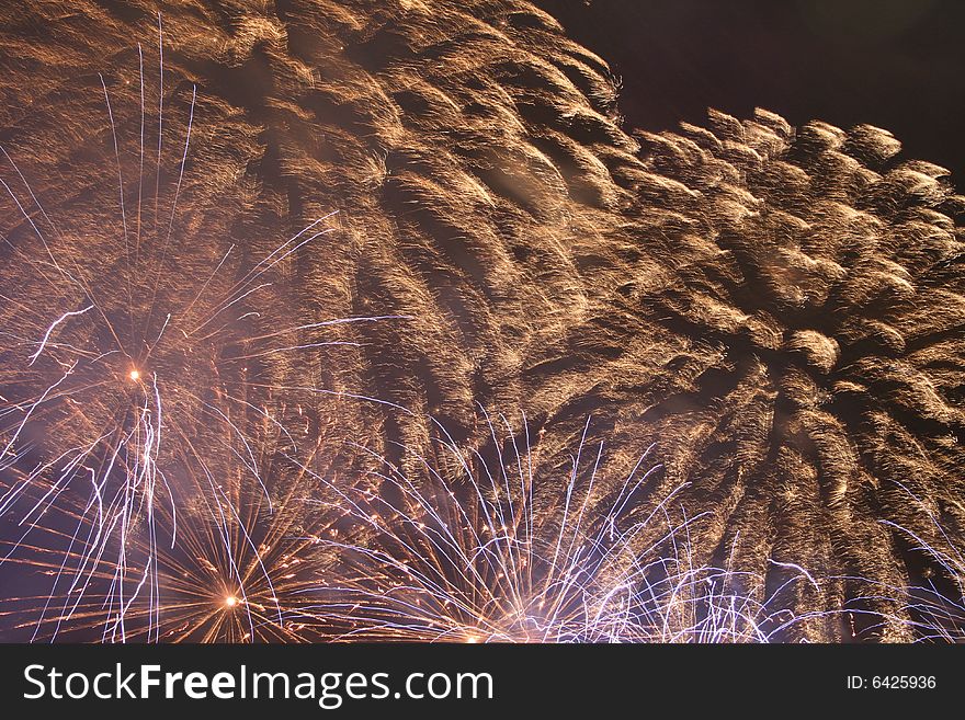 A red firework exploding at night. A red firework exploding at night