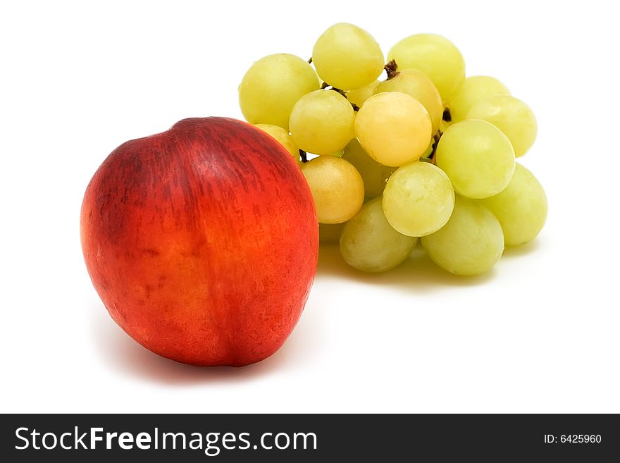 Grapes and peach on white background. Grapes and peach on white background