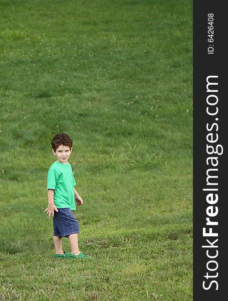 3 year old boy at the playground/grass. 3 year old boy at the playground/grass