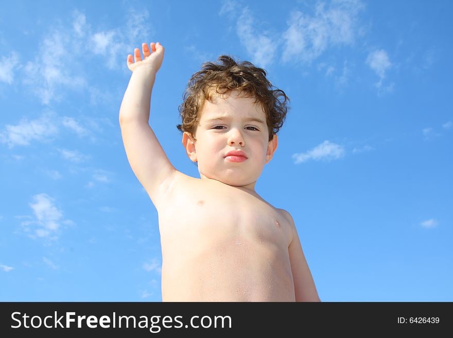 3 year old boy against the sky. 3 year old boy against the sky