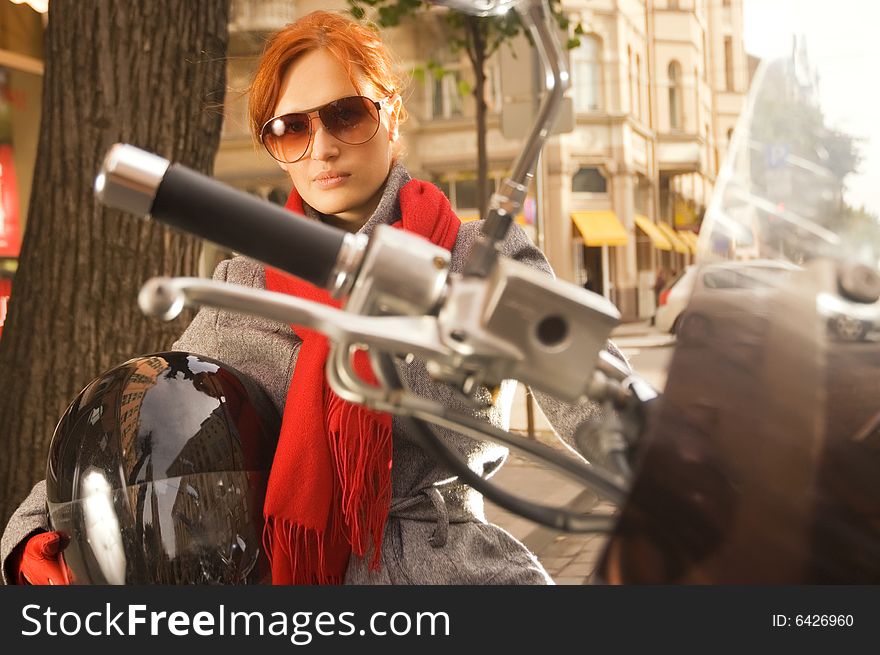 Beautiful woman on the motorcycle (focus on the hand)