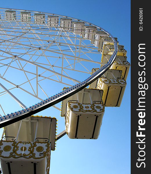 A view from the ground of a ferris wheel