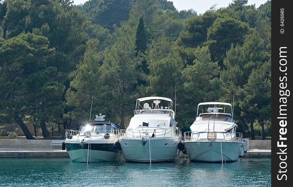 Photo of three yachts anchored at the berth. Photo of three yachts anchored at the berth