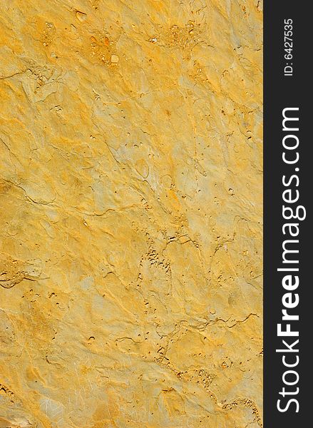 Pattern of colored rough yellow rock surface. Pattern of colored rough yellow rock surface