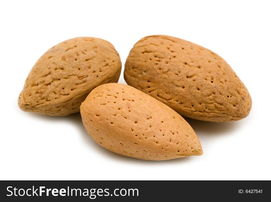 Three almonds on white background