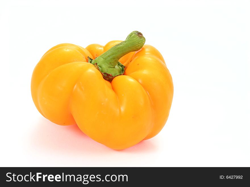 Single yellow paprika isolated on the white background