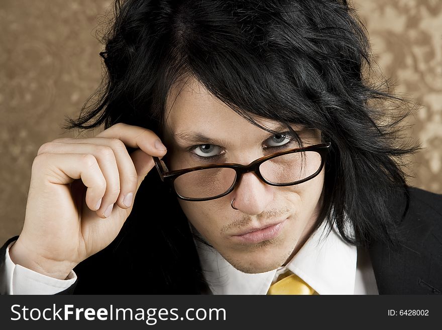 Handsome Young Man Looking Over the Top of his Glasses