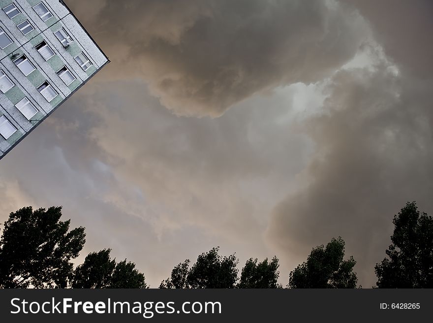 Dark, heavy rain clouds above flat. Dark, heavy rain clouds above flat