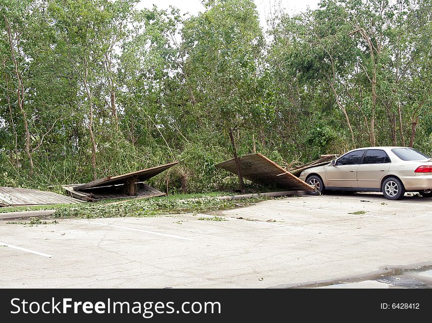 A fence blown down on a car from Hurricane Ike. A fence blown down on a car from Hurricane Ike