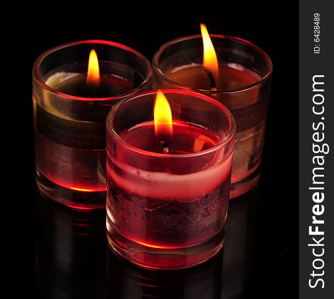 Various Candles over black background
