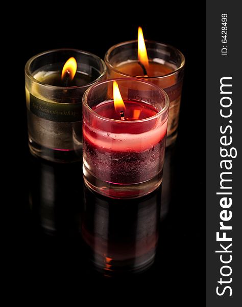 Various Candles over black background