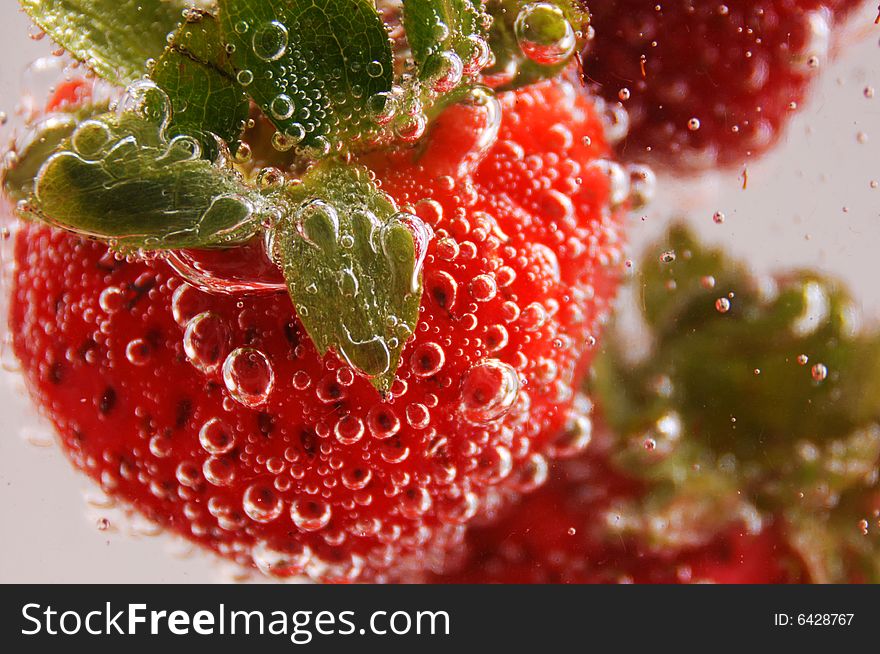 Closeup photo of strawberries under the water