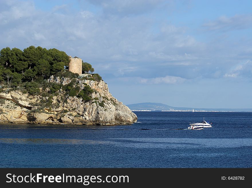 Coastline with a tower above a sea in Majorca in Spain