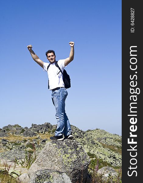 Young boy on the top of a mountain