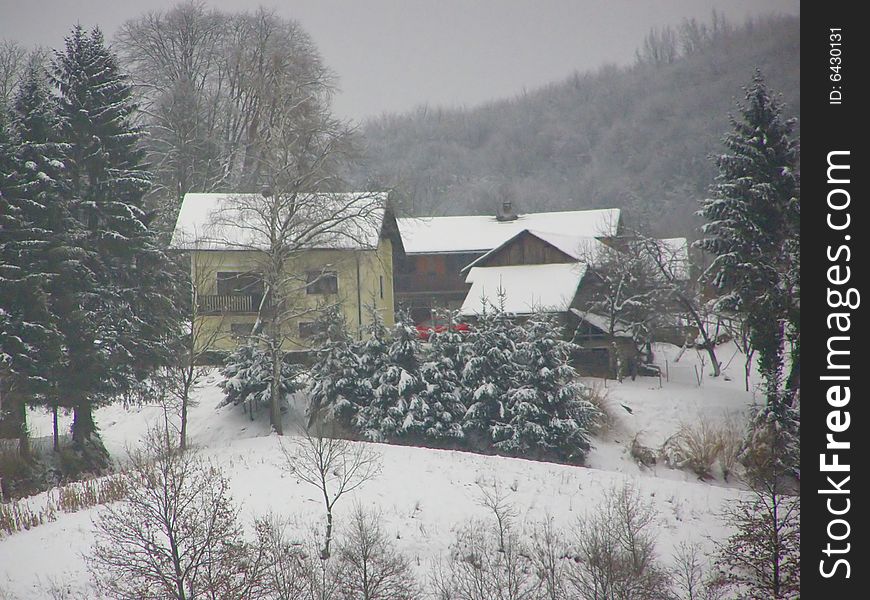 Tiny Bosnian village during snowy winter, single estate. Tiny Bosnian village during snowy winter, single estate