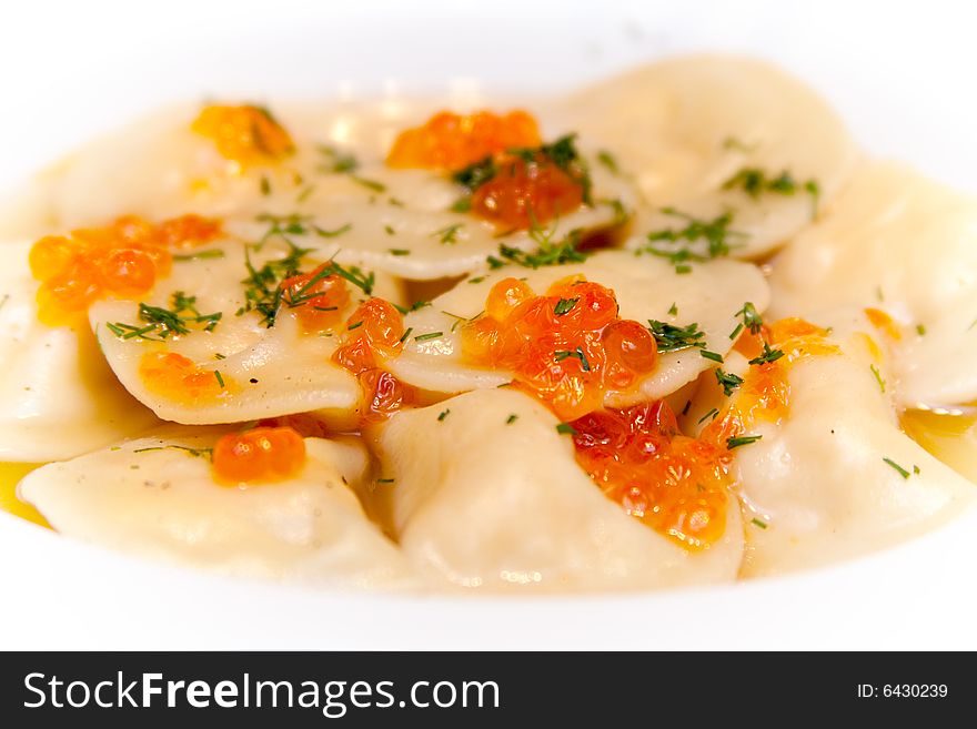 Pelmeni filled with fish and red caviar