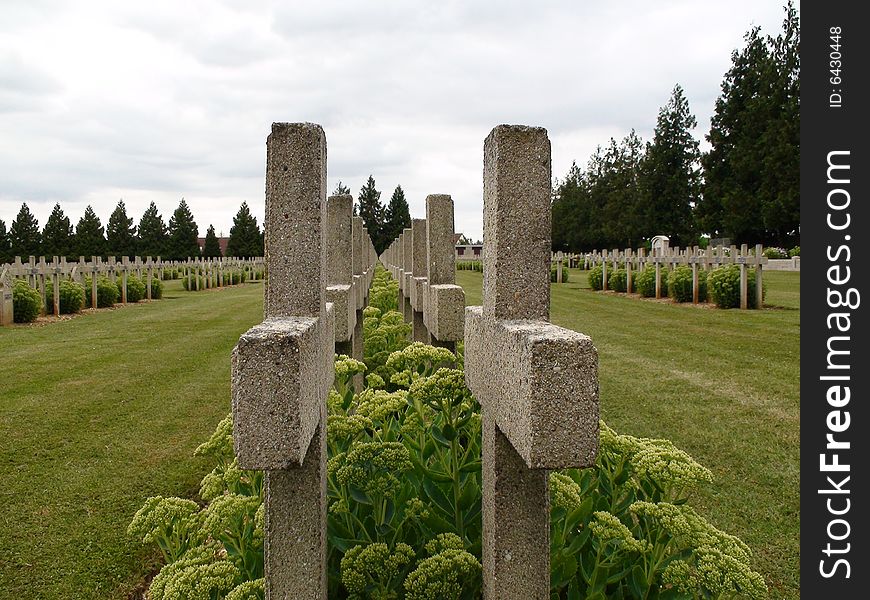 A row of crosses in the Montdidier National Cemetery in Montdidier, France. A primarily French cemetery but also includes Canadian graves and one German grave.