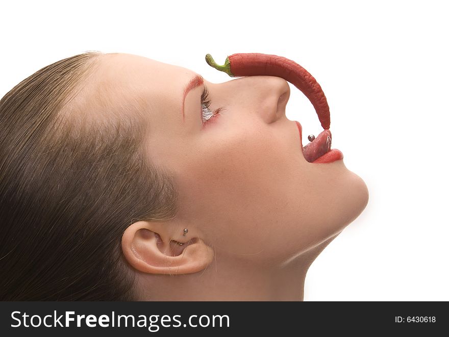 Nice young girl with red cayenne isolated over white. Nice young girl with red cayenne isolated over white