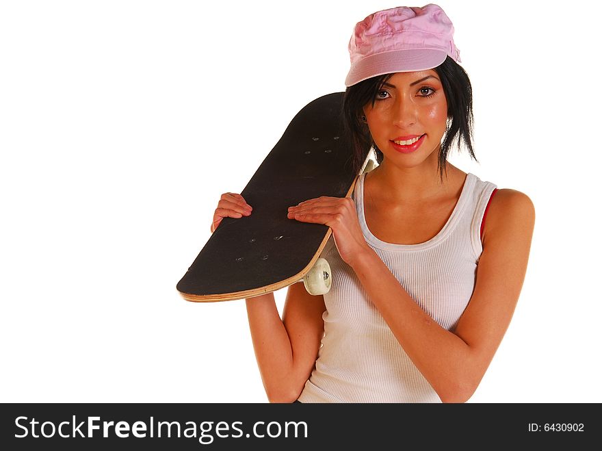 Attractive young latino female holding a skateboard. Attractive young latino female holding a skateboard