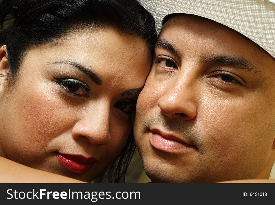 Headshot of two people looking at the camera. Headshot of two people looking at the camera