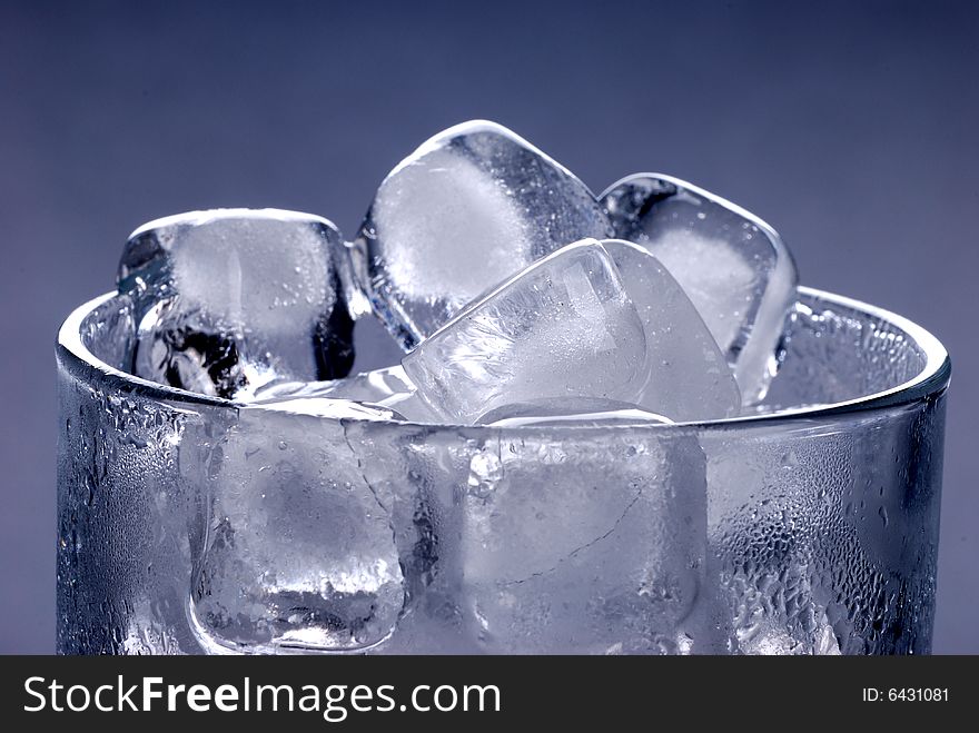 Ice cubes in glass in black background