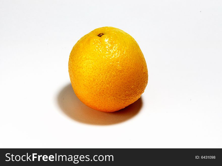 Fresh orange in a bowl on white background