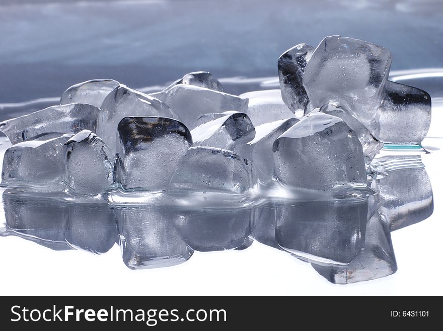 Ice cubes in smooth reflected  background