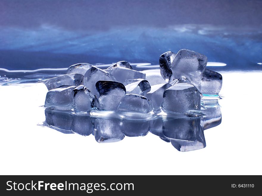 Ice cubes in smooth reflected  background